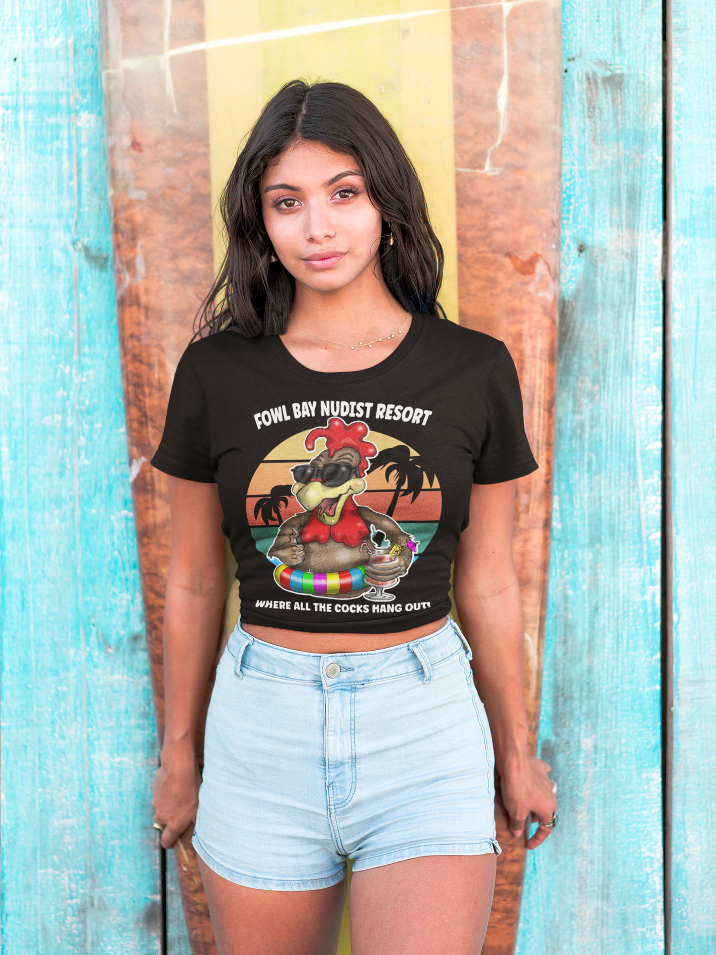 Young Ladies Wearing T-Shirt – Fowl Bay Nudist Resort Rooster Graphic Tee (Where All the Cocks Hang Out!)