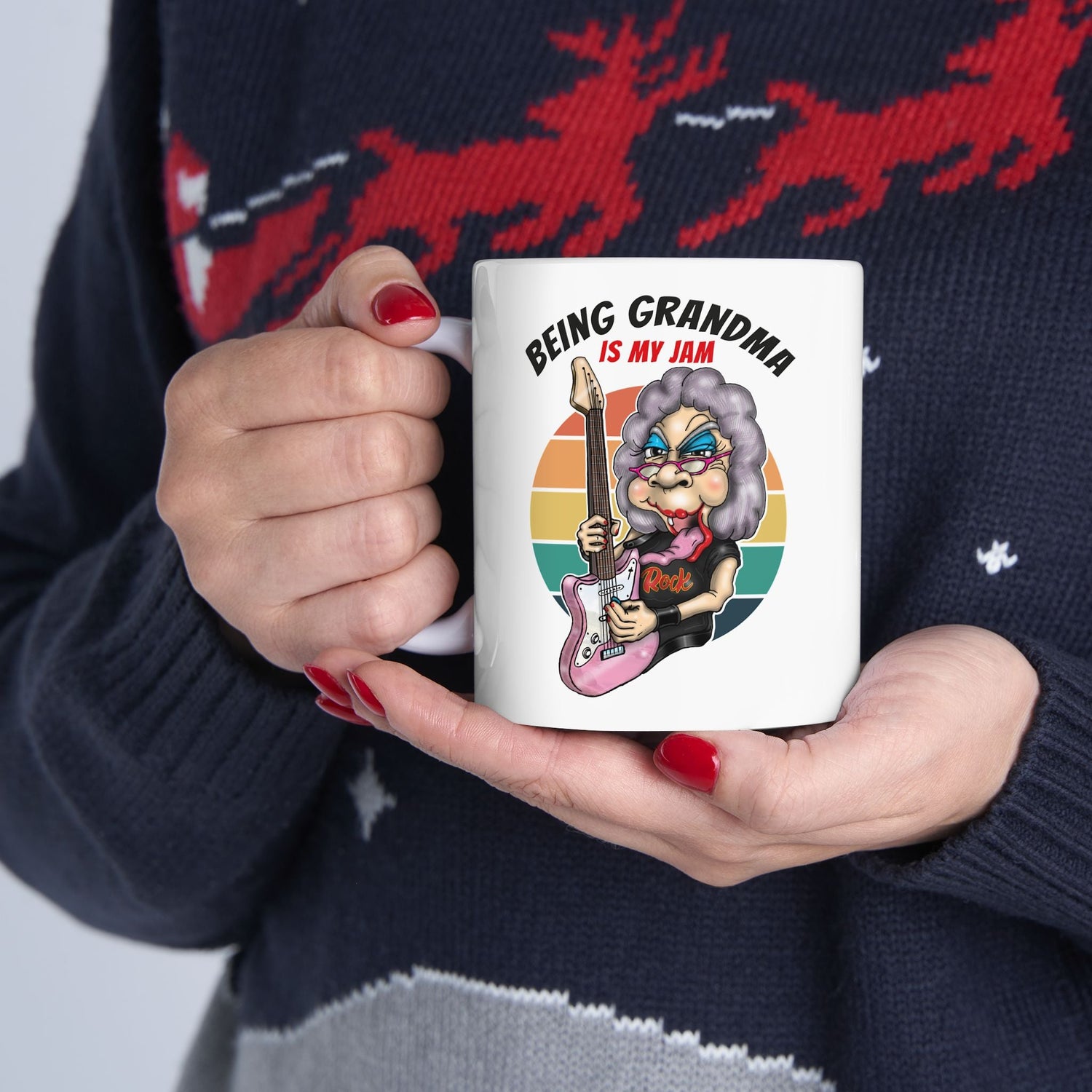 Lady holding white ceramic mug sporting funny Being Grandma is my Jam design